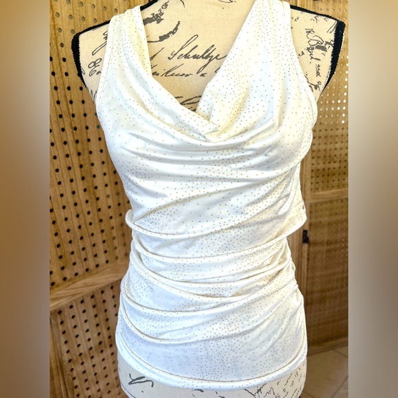 Cream color sleeveless top.Has Gold color Dots and a lace see through back. - Picture 3 of 8